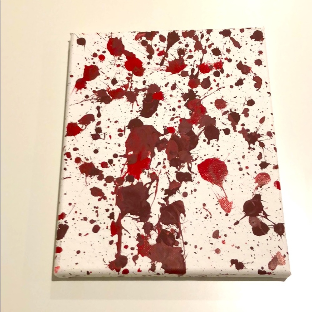 The canvas has big and small splashes on them